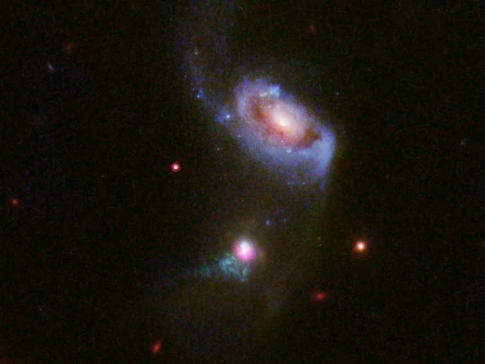 Як чорна діра поїдає галактику: вражаюче фото - фото 362922