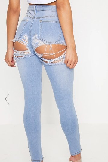 Ці нові джинси з порваною попкою виглядають так, наче за вами гналась зла собака - фото 384251