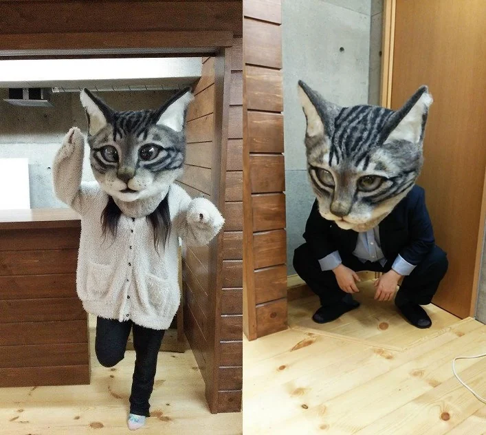 Японці придумали новий тренд і тепер носять гігантські котячі голови з шерсті - фото 393901