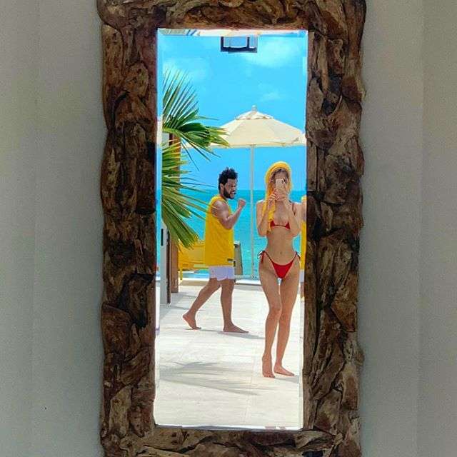 Закохані Белла Хадід і The Weeknd заінтригували спекотними знімками з Карибських островів - фото 429243