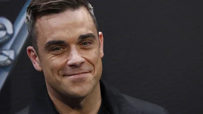 Роббі Вільямс повністю оголився для глянцю