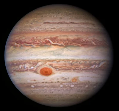В новом свете: телескоп Hubble сделал новые и необычные фото Юпитера - фото 514461