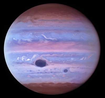 В новом свете: телескоп Hubble сделал новые и необычные фото Юпитера - фото 514464